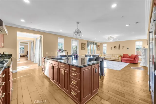 a living room with furniture a rug and a floor to ceiling window
