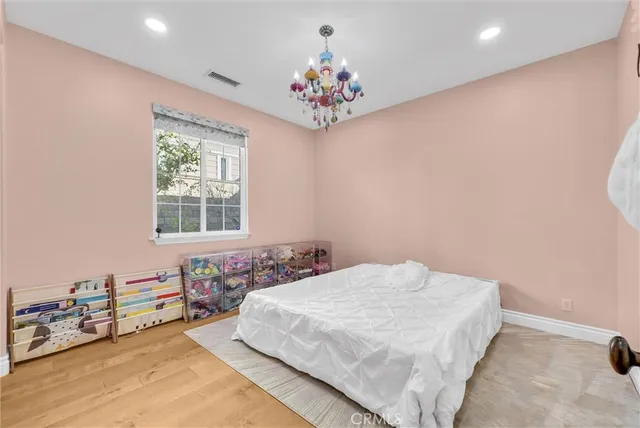 a bathroom with a granite countertop sink a toilet and a mirror