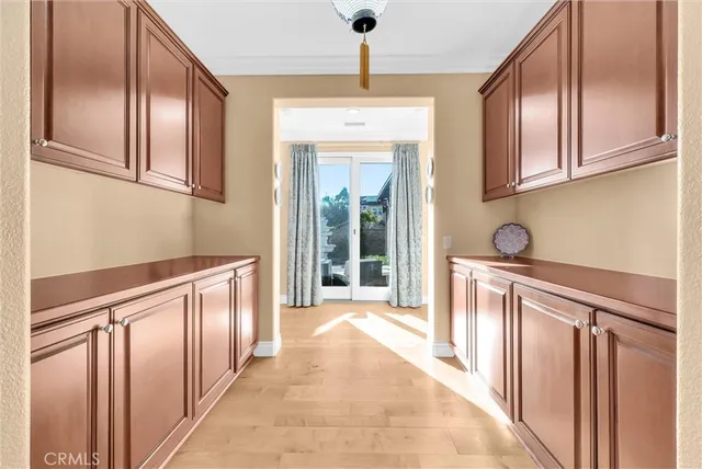 a kitchen with granite countertop a refrigerator and cabinets