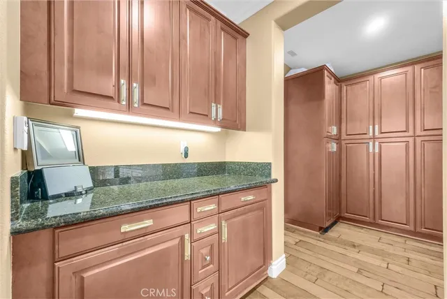 a view of a house with sitting area and garden