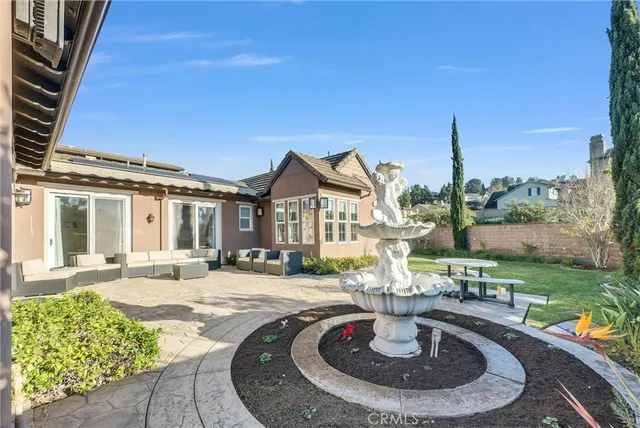 a view of a garden with a building in the background