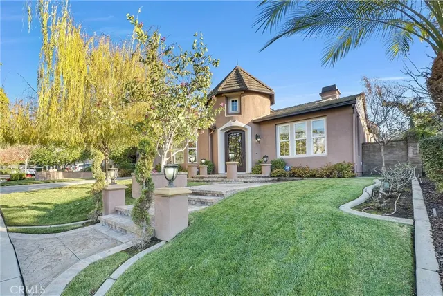 a front view of a house with garden