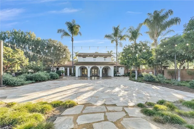 an aerial view of residential houses with city view