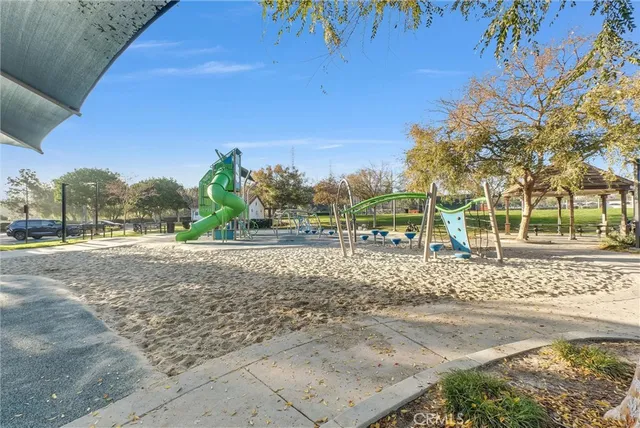 a front view of a house with a yard table and chairs