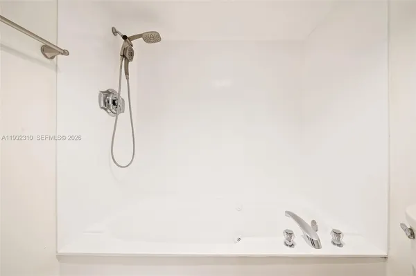 a view of a room with shelf on the wall