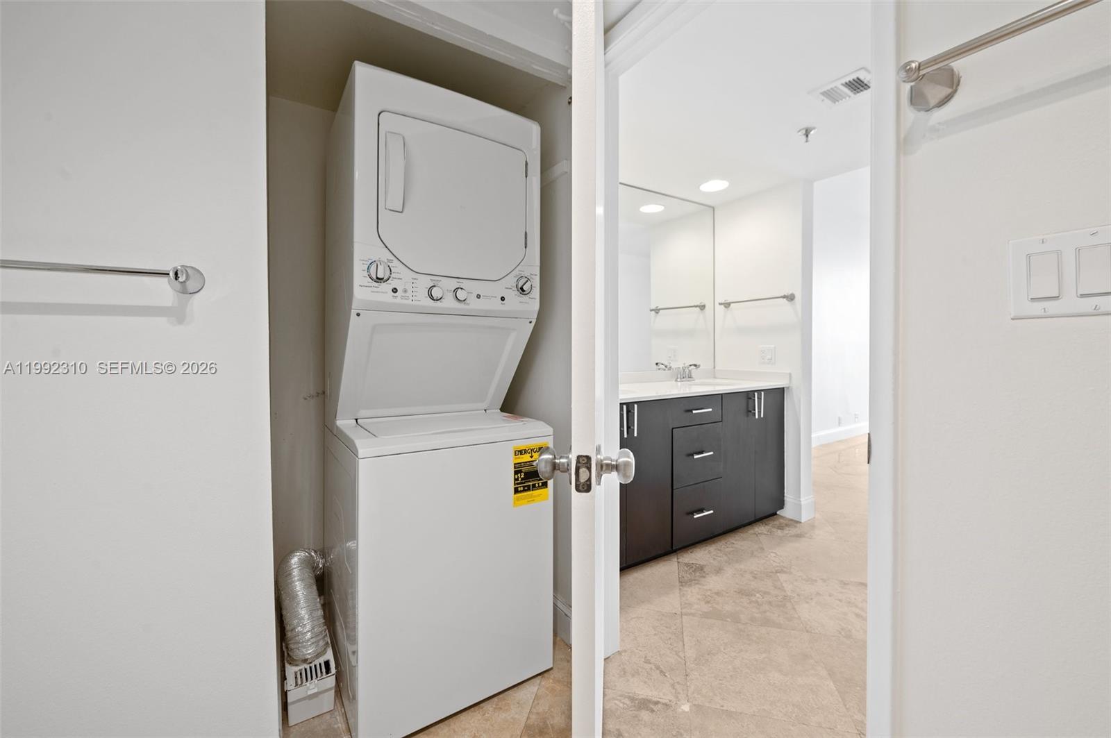 520 Brickell Key Drive, Unit A1712 Miami, FL 33131 - Photo 24 of 34 a bathroom with a sink a toilet and shower