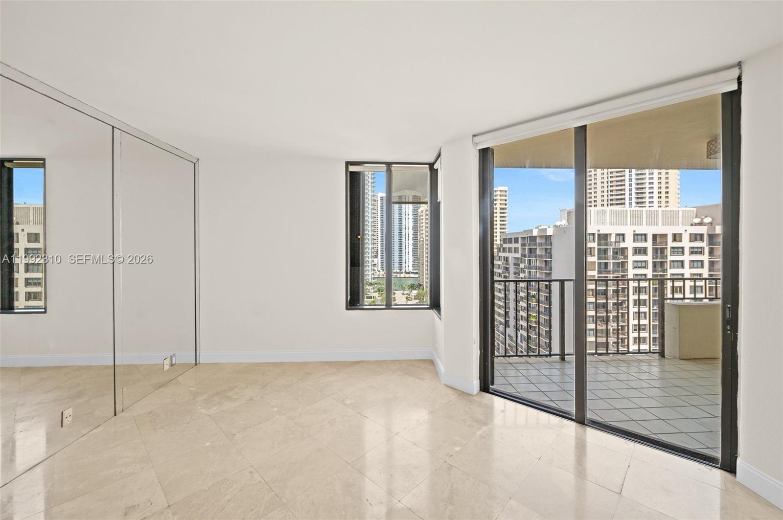 520 Brickell Key Drive, Unit A1712 Miami, FL 33131 - Photo 4 of 34 a view of an empty room with a window