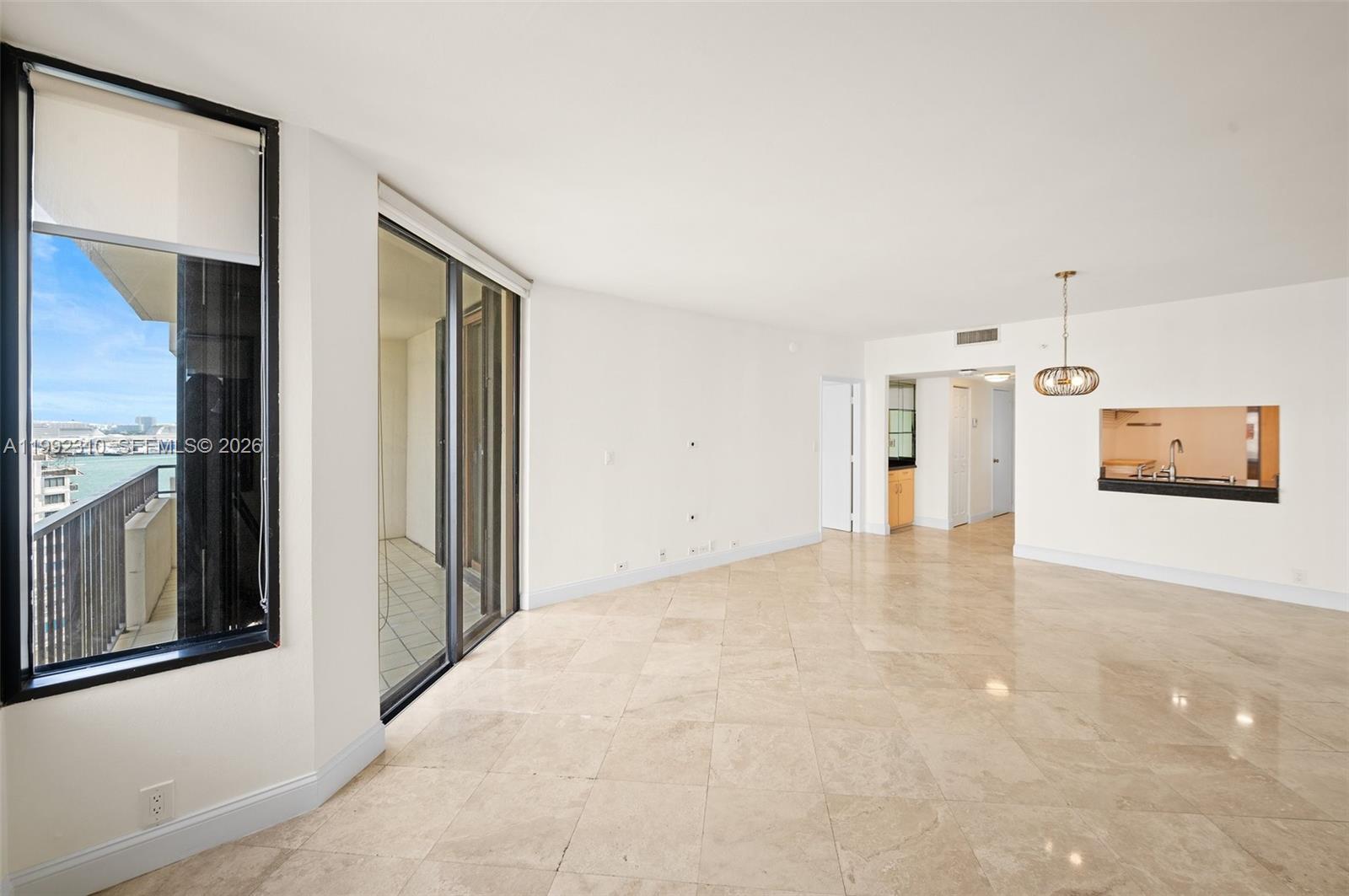 520 Brickell Key Drive, Unit A1712 Miami, FL 33131 - Photo 8 of 34 a view of a big room with closet and windows