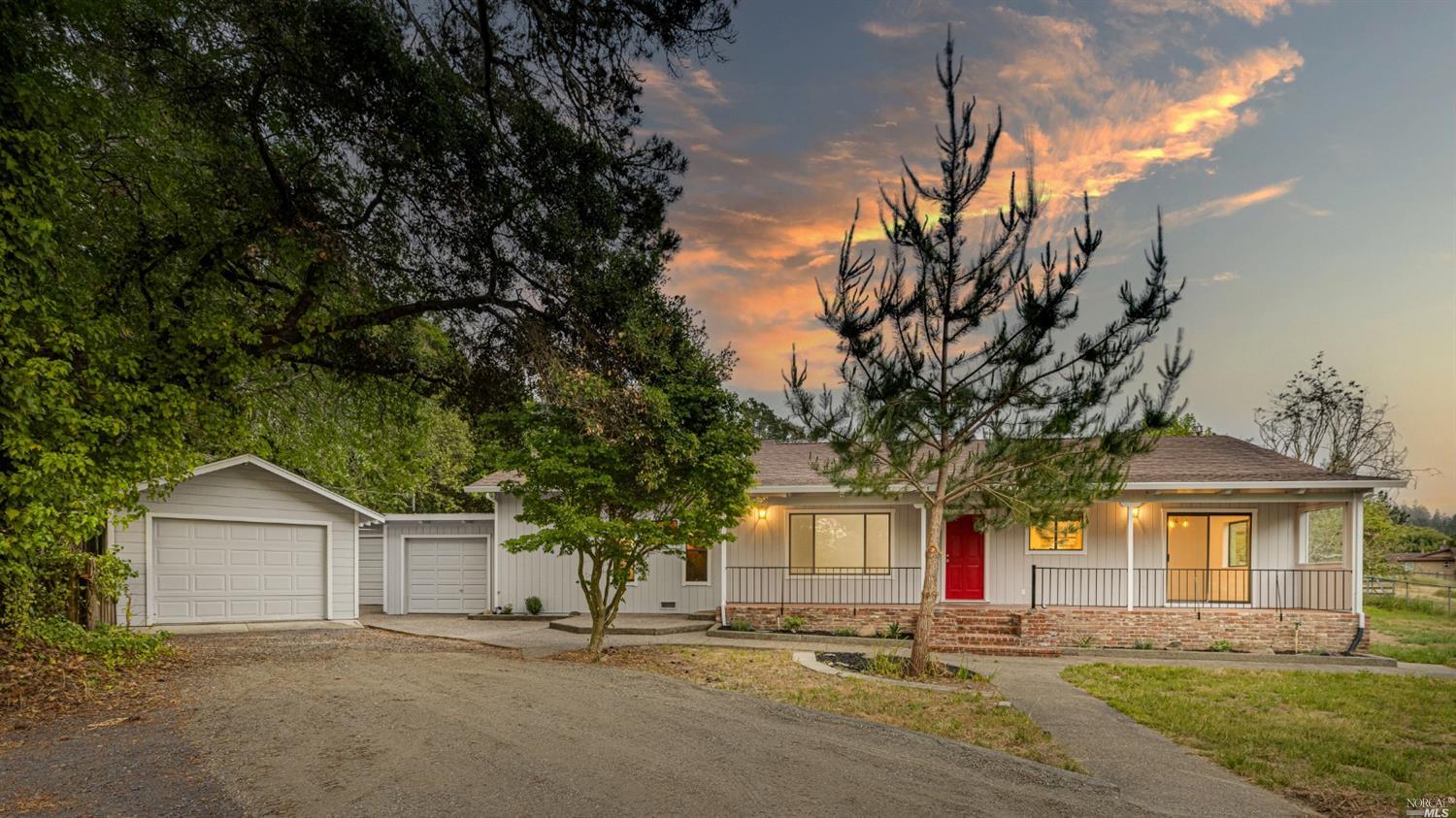 701 West Sexton Road Sebastopol, CA 95472 - Photo 1 of 1 a front view of a house with a garden and tree