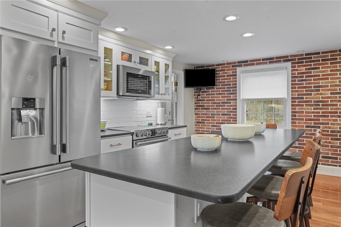 45 Linden Road Barrington, RI 02806 - Photo 9 of 50 Chef's Kitchen, Breakfast Bar/Center Island, Hardwoods, Brick Accent Wall