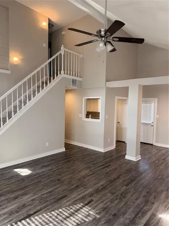 a view of an entryway with wooden floor