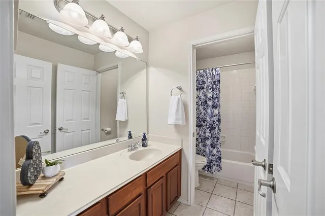 a bathroom with a sink a double vanity and a mirror