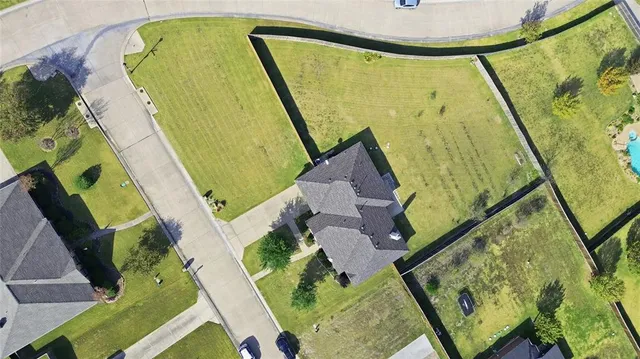 an aerial view of a swimming pool