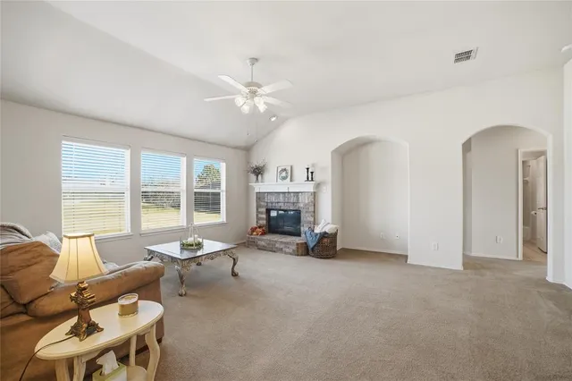 a view of a livingroom with furniture and a fireplace