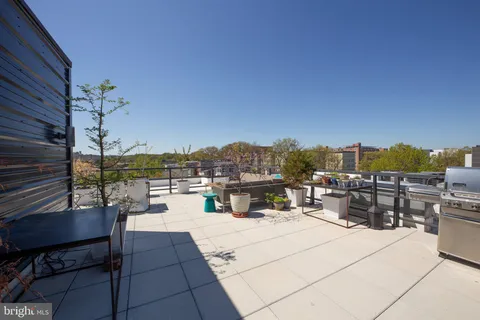 a view of a terrace with furniture and stove