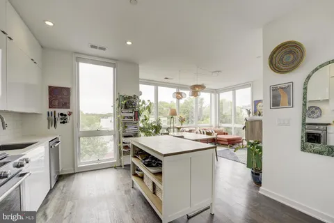 a kitchen with a stove and a refrigerator