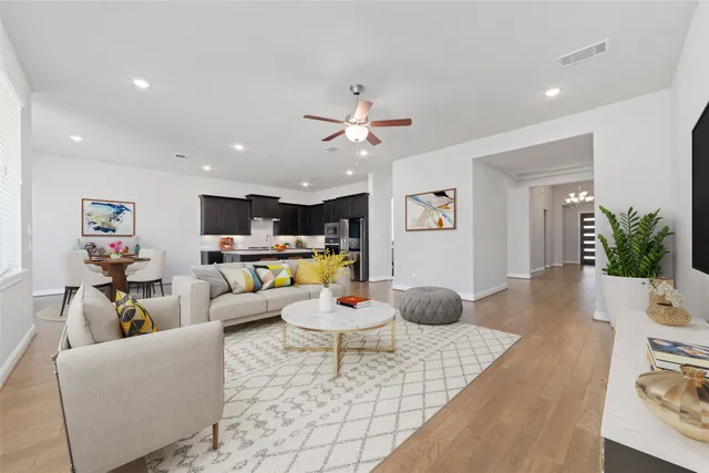 a living room with furniture and white walls