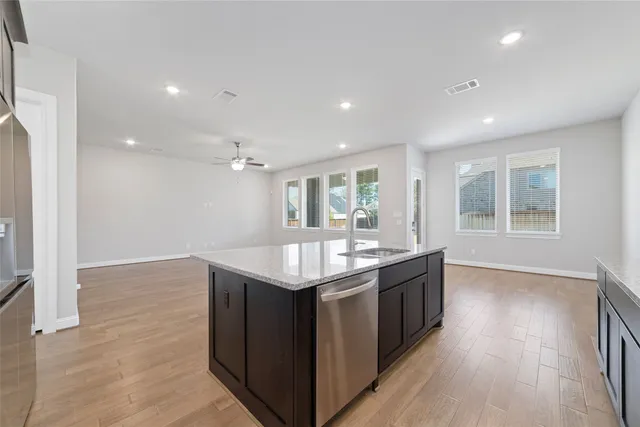 a kitchen with a sink and window