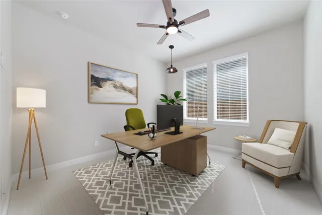 a work room with furniture and a window