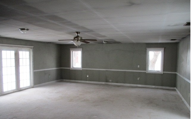 24902 Poplar Road Genoa, IL 60135 - Photo 5 of 11 an empty room with a empty space and windows