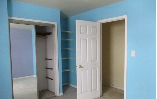 24902 Poplar Road Genoa, IL 60135 - Photo 10 of 11 a view of a hallway with a door and closet