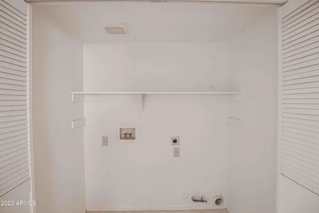 a view of a livingroom with a ceiling fan and window