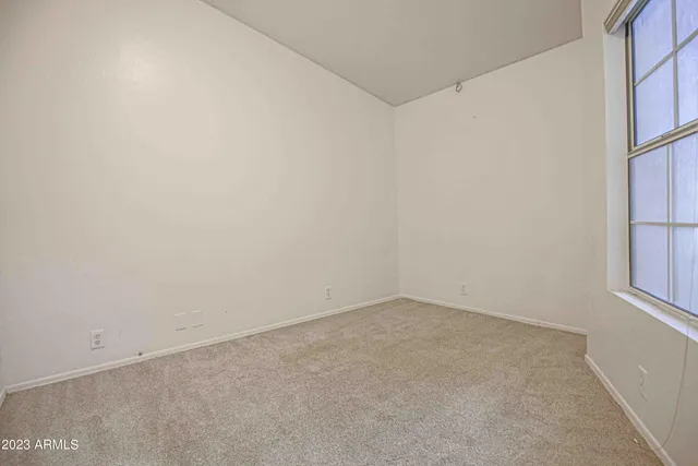 an empty room with a empty space and window