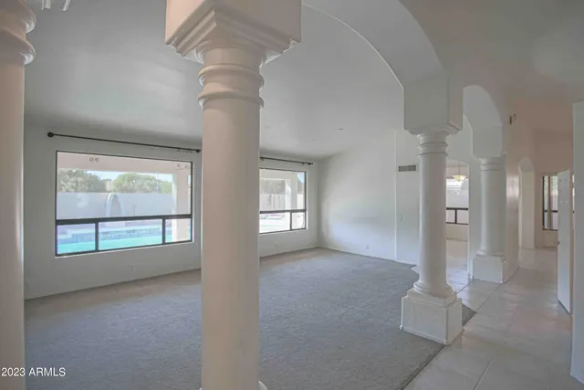 a view of a big room with closet and mirrors