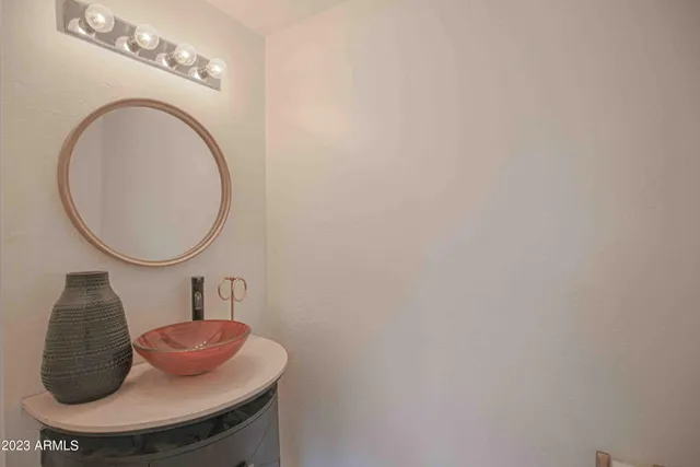a large white kitchen with a large window