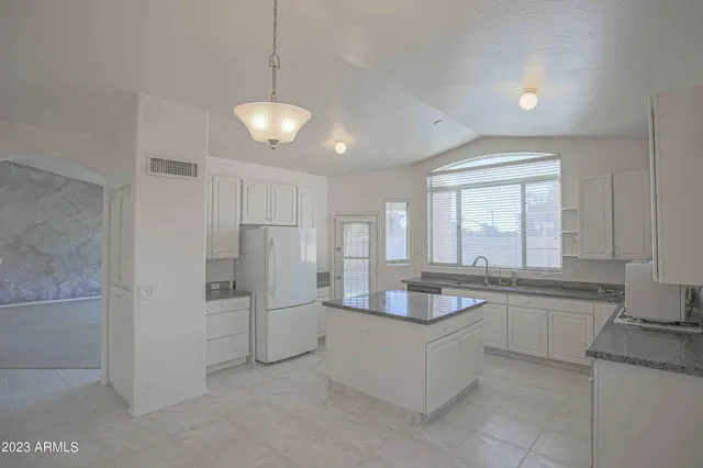 an empty room with a fireplace