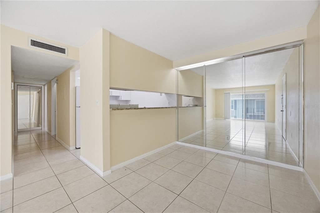 925 West Oak Ridge Road, Unit 925C Orlando, FL 32809 - Photo 4 of 15 a view of a big room with closet and windows