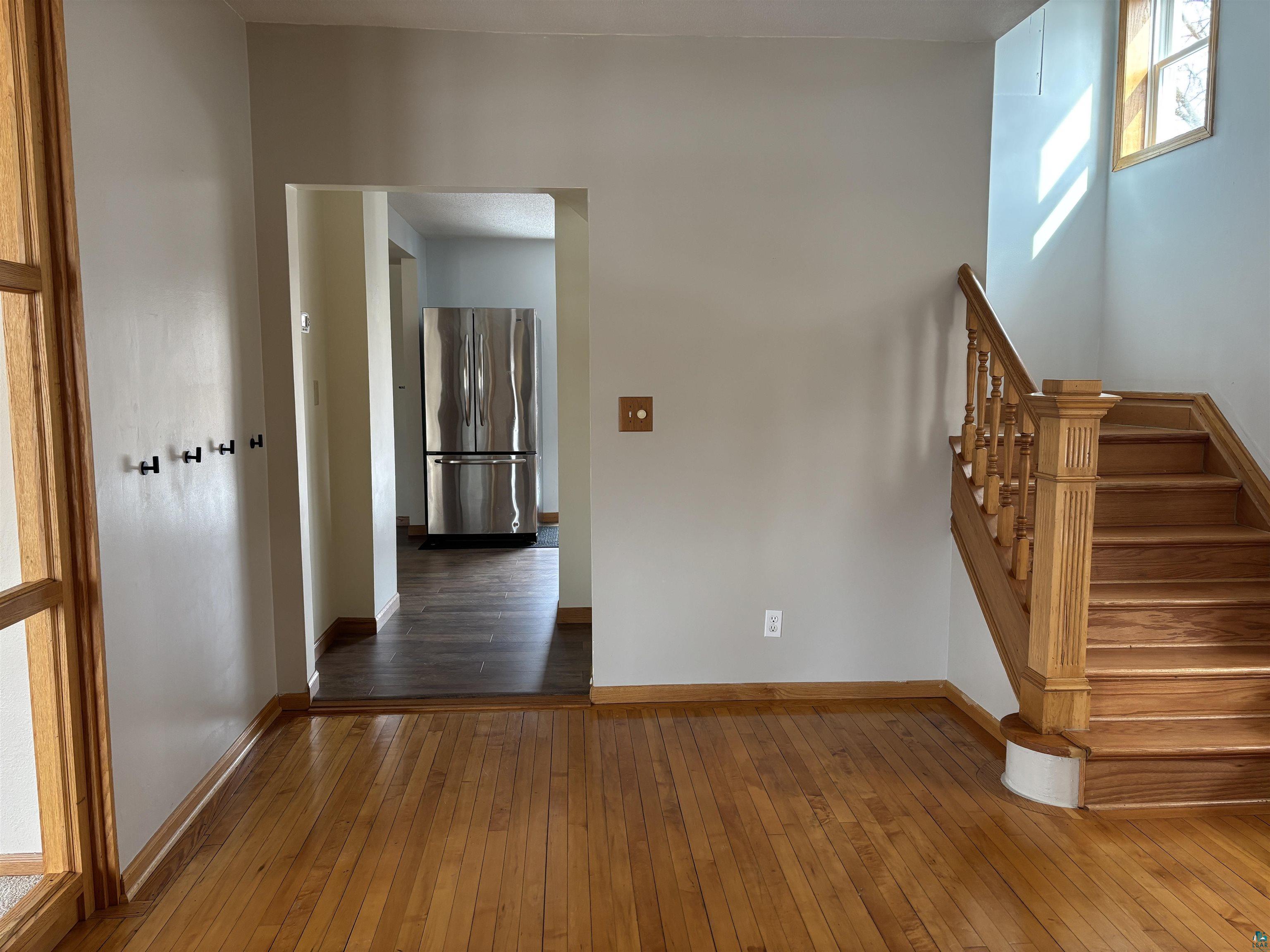 21 4th Street Proctor, MN 55810 - Photo 8 of 35 Staircase featuring baseboards and wood-type flooring
