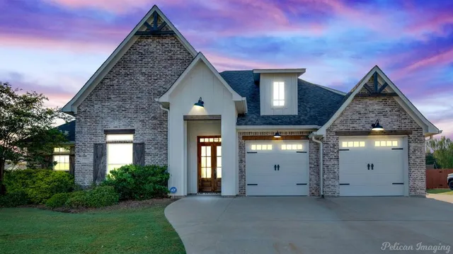 a view of a house with brick walls and windows