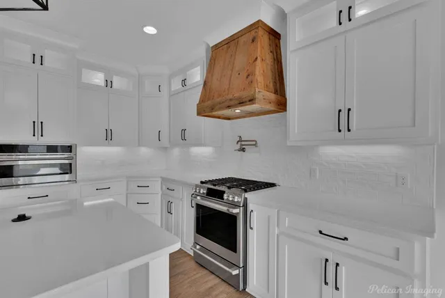 a kitchen with cabinets and appliances
