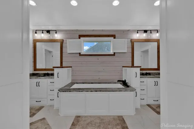 a bathroom with a tub and a shower