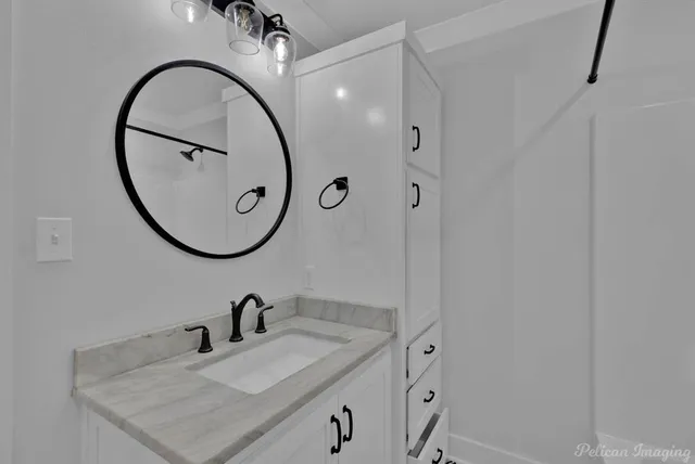 a bathroom with a shower and a sink