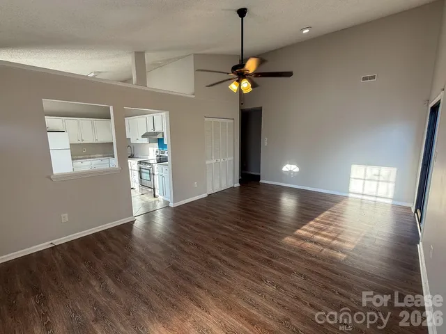 a view of outdoor space with wooden floor and windows