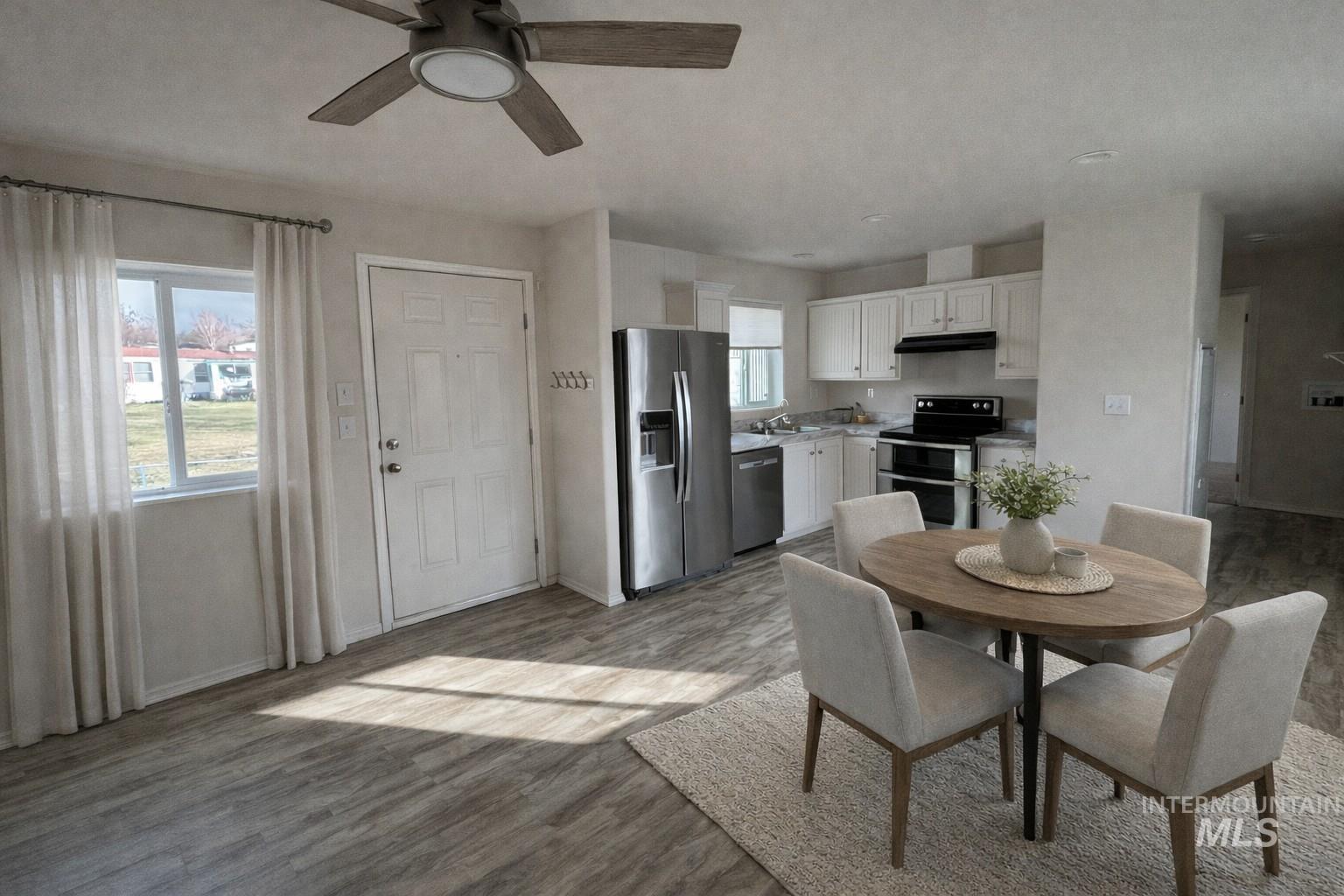 1500 West 7th Street Weiser, ID 83672 - Photo 2 of 10 Dining space featuring a ceiling fan and light wood-style flooring