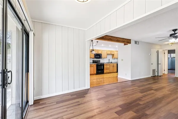a kitchen with a sink stove and refrigerator
