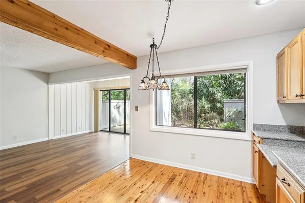 a kitchen with stainless steel appliances granite countertop a refrigerator a stove top oven a sink and dishwasher