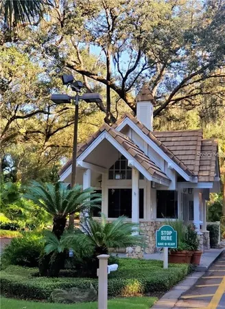 a big yard with trees in the background