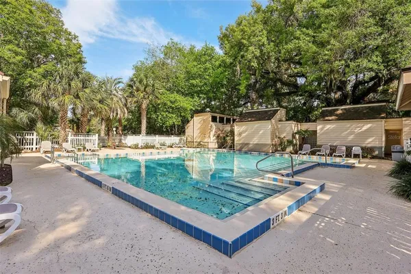 a view of a patio with a table and chairs