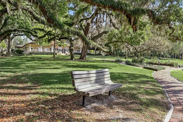 a view of a small yard with wooden fence
