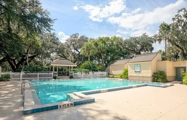 a view of a chair and table in the garden