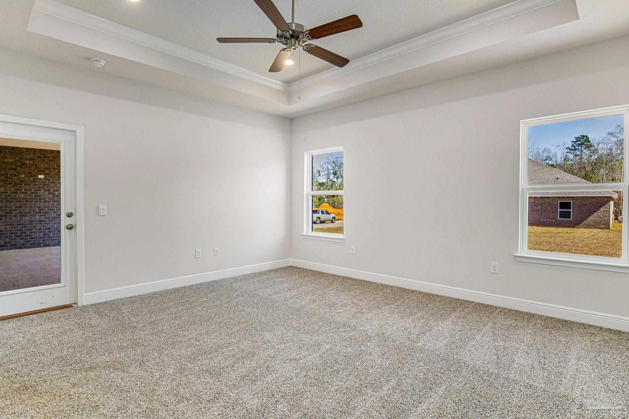 3152 Silver Maple Drive Cantonment, FL 32533 - Photo 18 of 25 an empty room with windows and fan