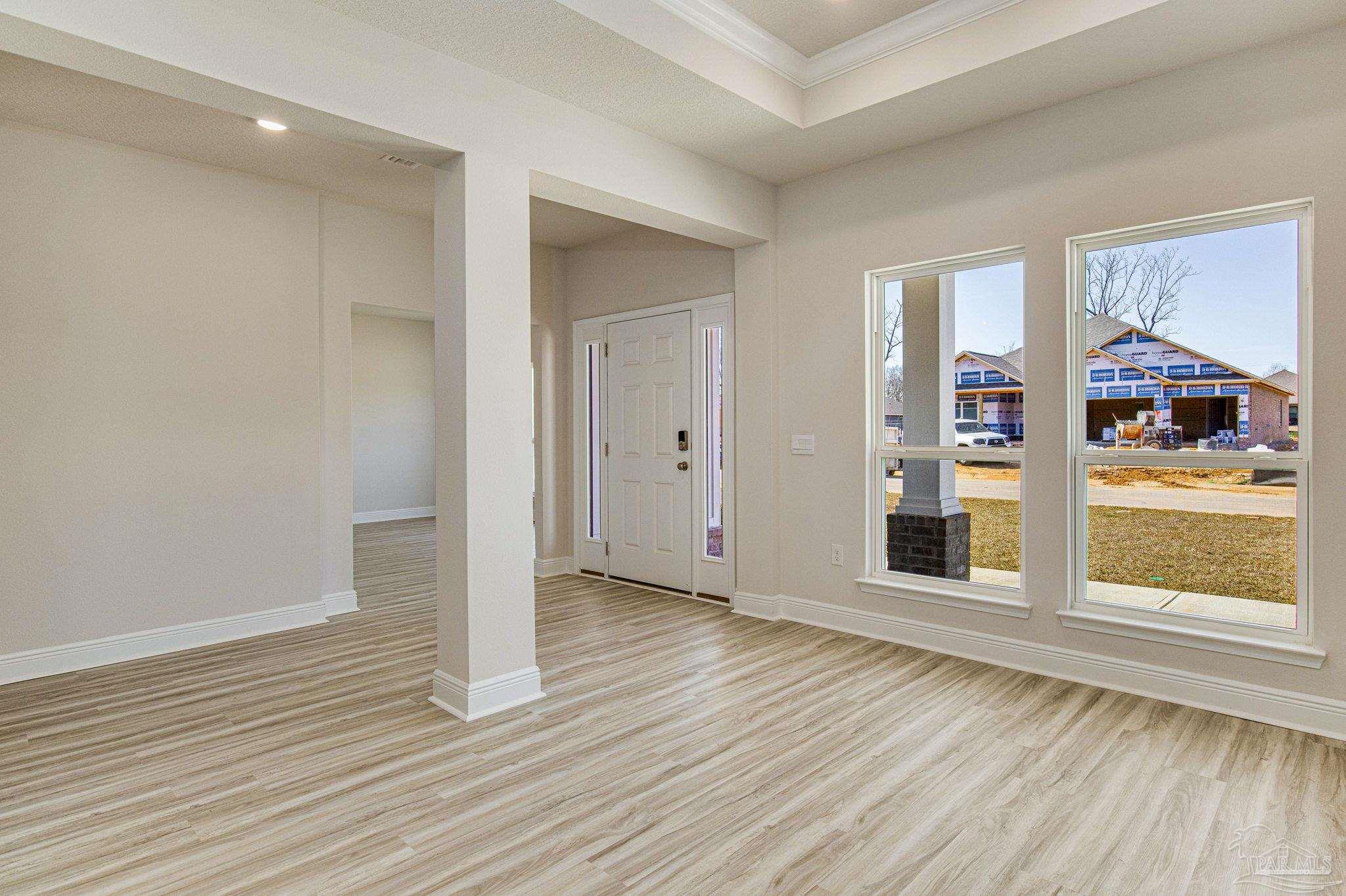 3152 Silver Maple Drive Cantonment, FL 32533 - Photo 4 of 25 wooden floor in an empty room with a window