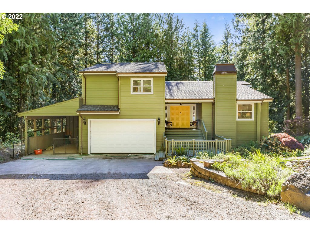42069 Southeast Erickson Road Sandy, OR 97055 - Photo 24 of 32 a front view of a house with a yard and garage