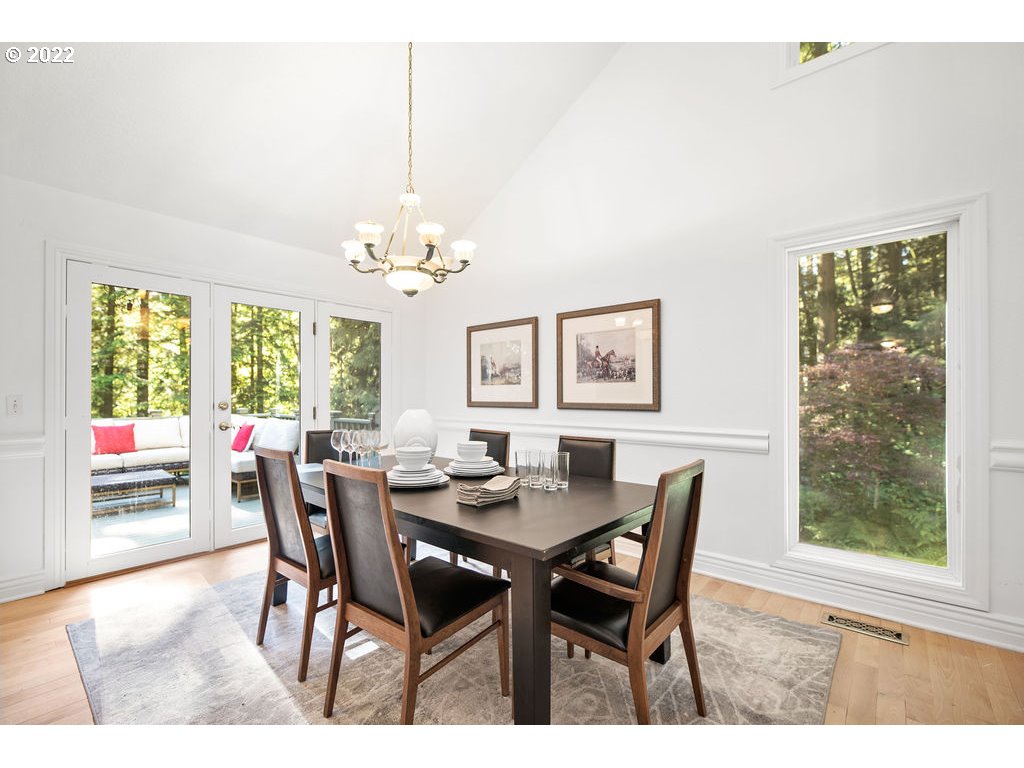 42069 Southeast Erickson Road Sandy, OR 97055 - Photo 9 of 32 a view of a dining room with furniture wooden floor and a chandelier