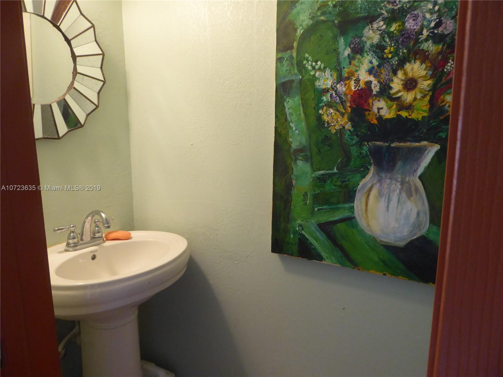 2726 West 60th Street, Unit 68 Hialeah, FL 33016 - Photo 11 of 23 a bathroom with a sink and mirror