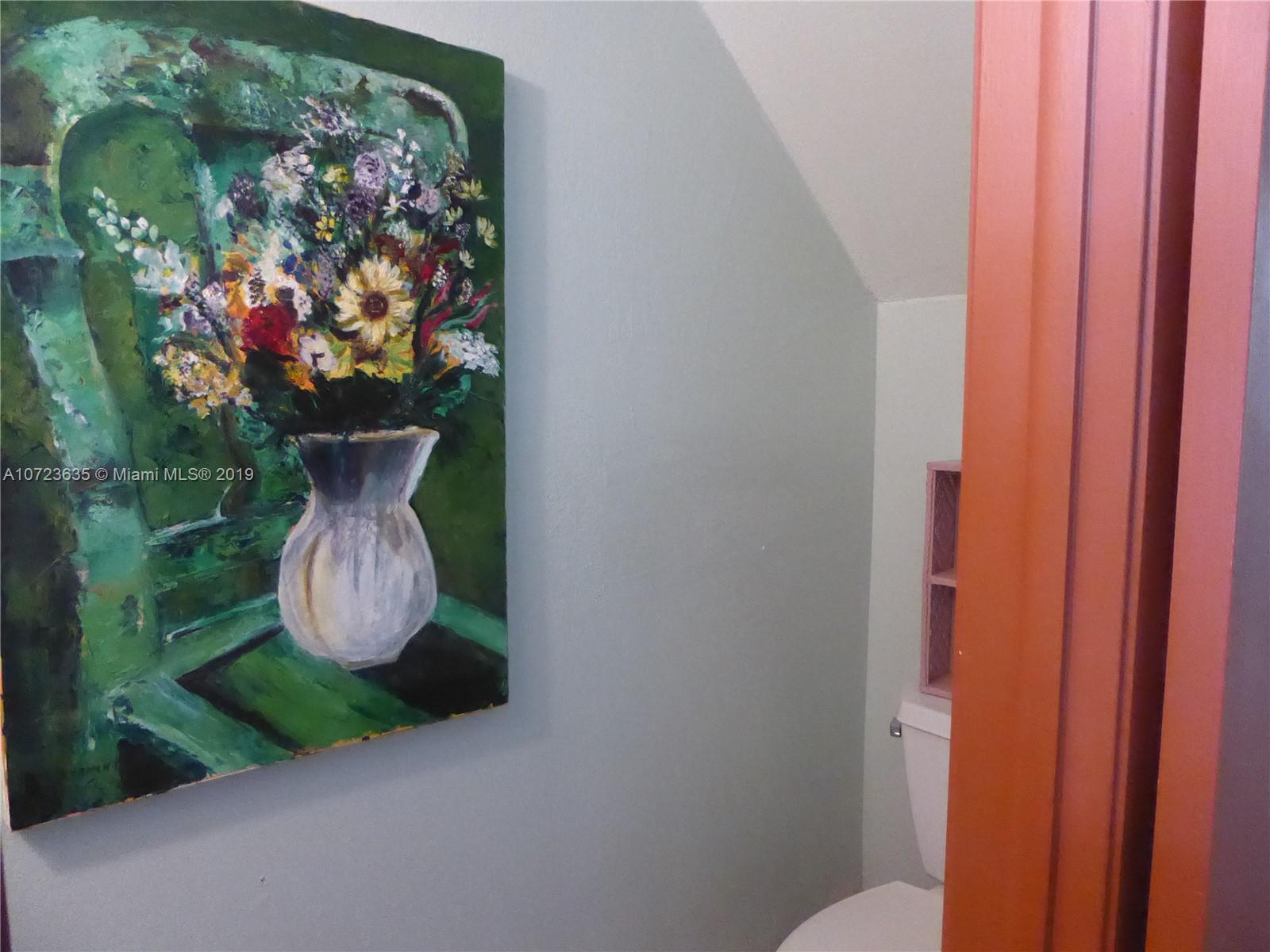 2726 West 60th Street, Unit 68 Hialeah, FL 33016 - Photo 12 of 23 a vase of flowers sitting on a table